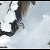 2011-trennis-baer-sled-pose-near-rocks-web